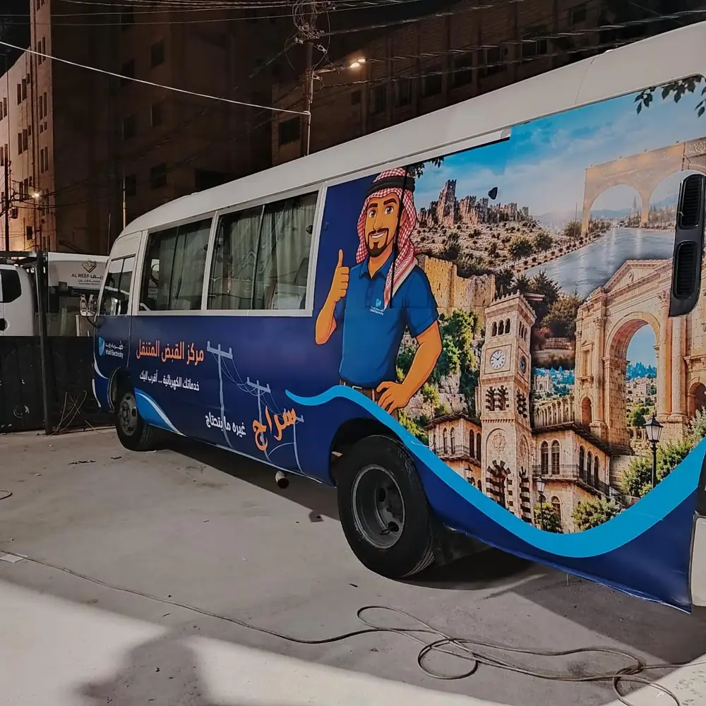 Bus wrap with car stickers by Al Reef Advertising Industry