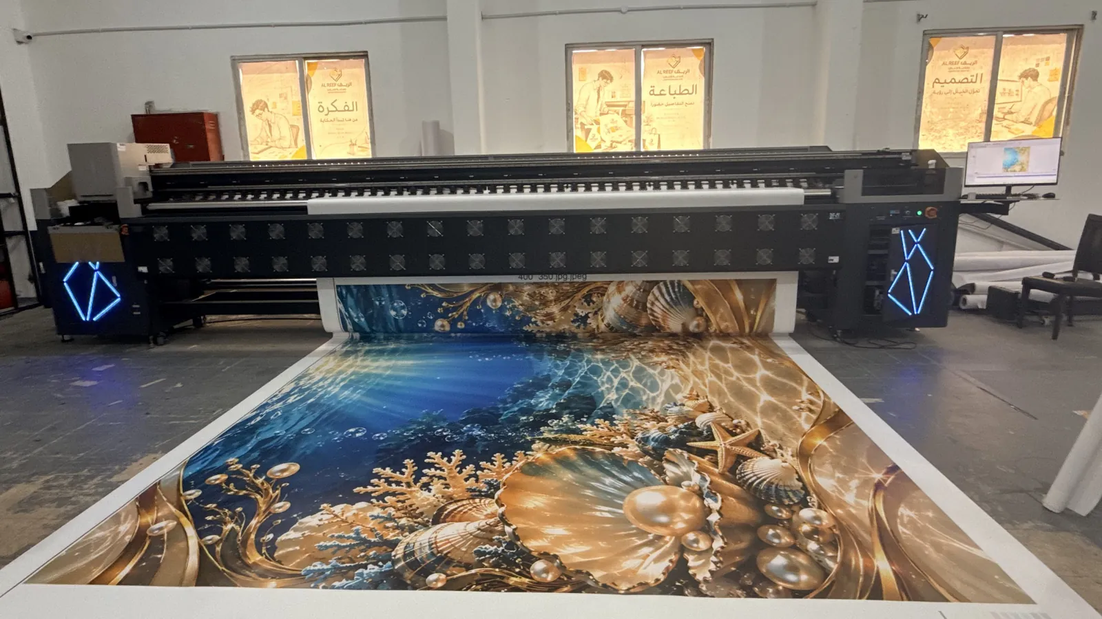 Al Reef 5 m printer printing a large seashell banner